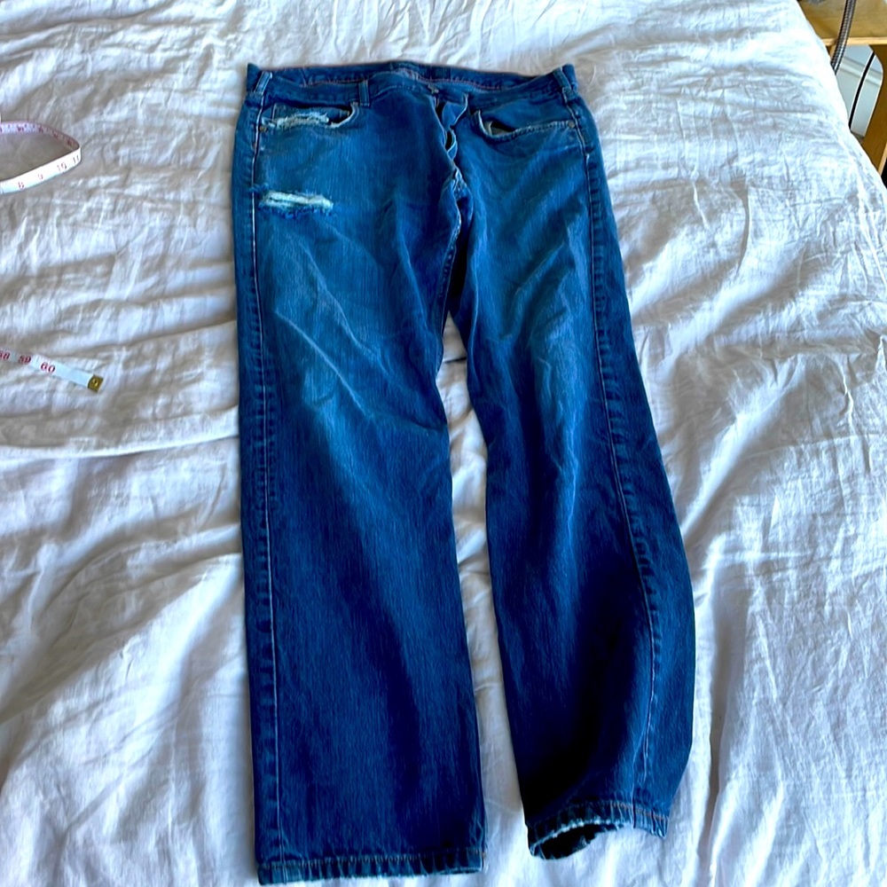 Patagonia jeans. Very broken in—some holes.